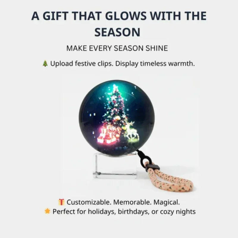 Glowing ornament featuring a Christmas tree with gifts, displayed on a clear stand, festive decor.