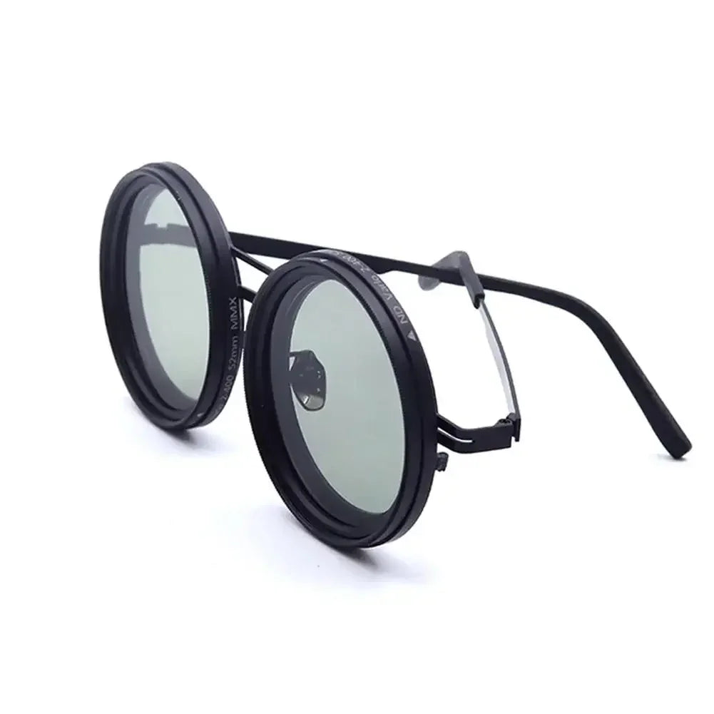 Round black steampunk sunglasses with metal frame and tinted lenses, futuristic streetwear accessory