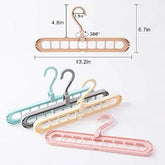 Plastic multi-slot foldable clothes hangers in pastel colors with 360-degree swivel hooks.