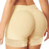 Beige seamless high-waisted shapewear shorts with lace trim and body-enhancing fit