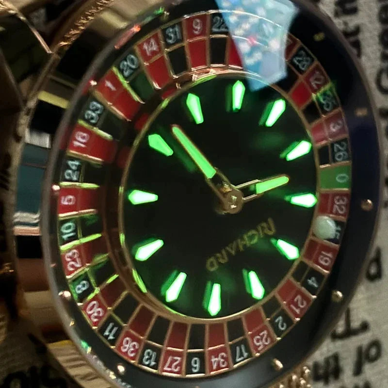 Close-up of a roulette-themed wristwatch with gold accents and glowing green markers.