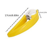 Yellow plastic and stainless steel kitchen slicer tool, 17cm long by 5cm wide