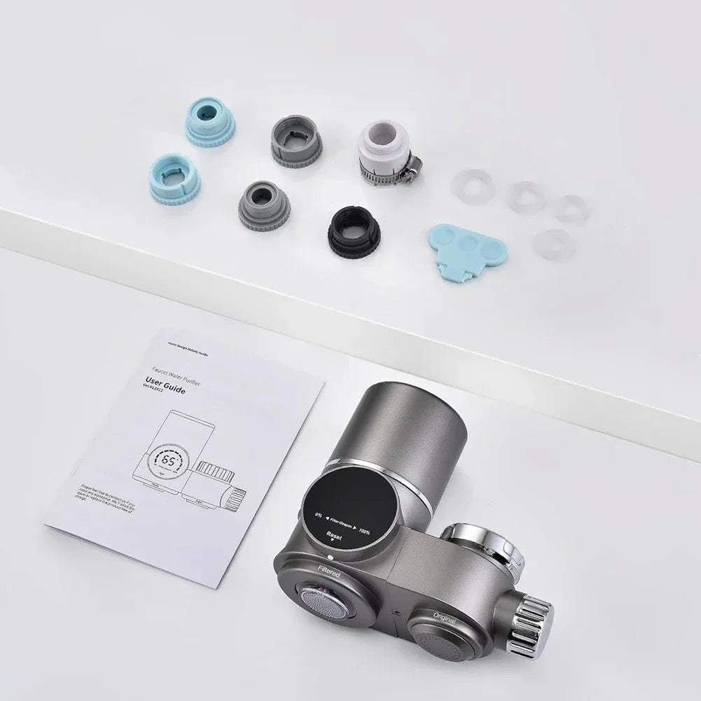 Modern faucet water purifier with digital display, installation adapters, and user manual on white background.