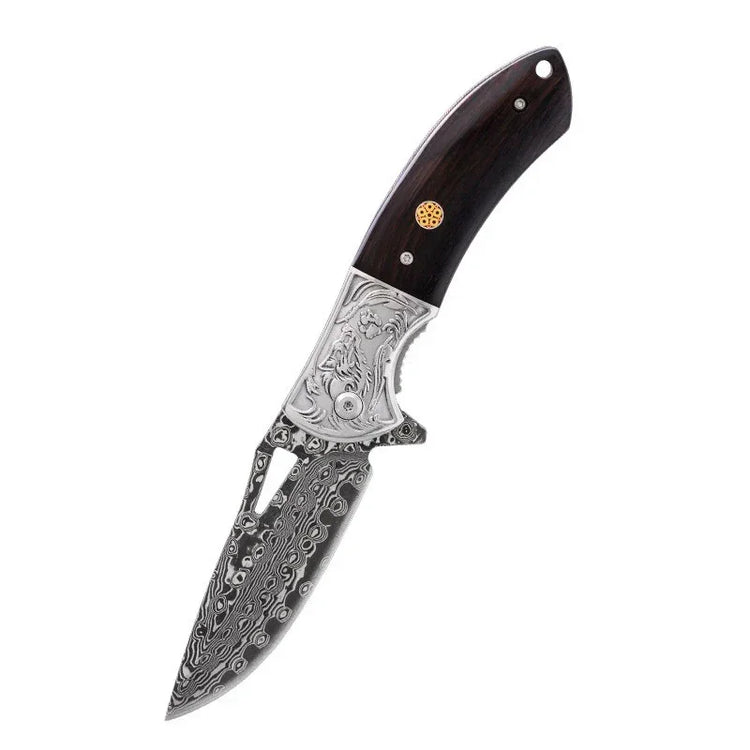 Folding knife with engraved silver handle and patterned Damascus steel blade