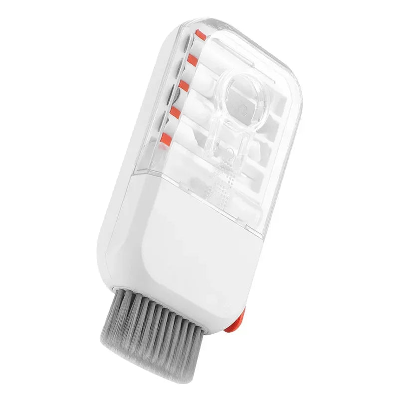Compact white plastic cleaning brush with gray bristles and transparent cover