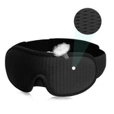 Black breathable sleep mask with adjustable strap and soft, textured fabric for comfort
