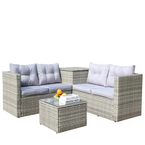 Modern outdoor patio set with gray rattan weave and light gray cushioned seating, glass-top table.