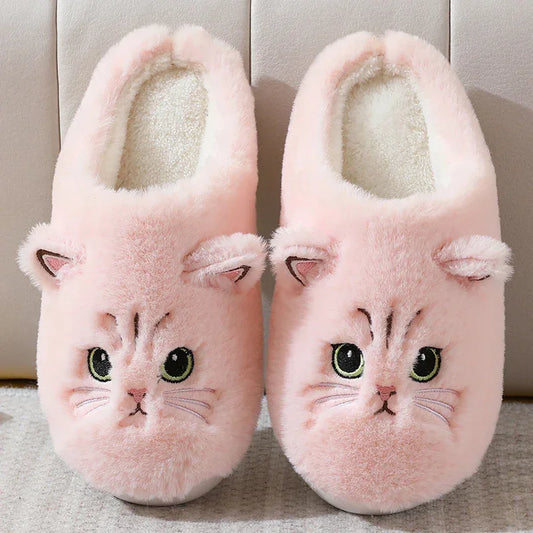 Pink plush cat face slippers with embroidered details and cozy fleece lining, comfy fit