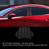 Red five-door hatchback with black carbon fiber center column stickers applied to pillars.