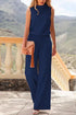 Woman wearing sleeveless navy blue jumpsuit with wide leg pants, relaxed fit, outdoor setting