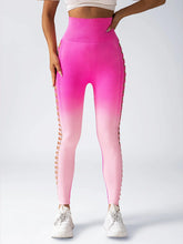 High-waisted pink ombre leggings with side lattice cutouts, fitted athletic style