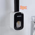 Wall-mounted black and white plastic holder with a handle, modern bathroom accessory.