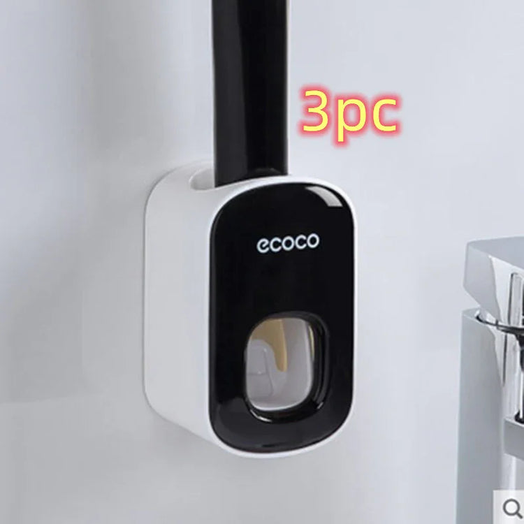 Wall-mounted black and white plastic holder with a handle, modern bathroom accessory.
