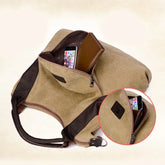 Khaki canvas shoulder bag with brown leather accents, zippered pocket, spacious fit