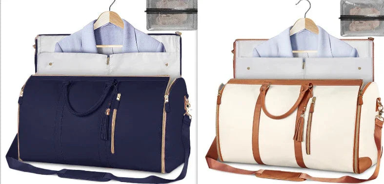 Two duffel travel bags, one navy blue and one cream with tan accents, displayed with hanging dress shirts and toiletry pouches, highlighting spacious, structured design and leather-like trim.