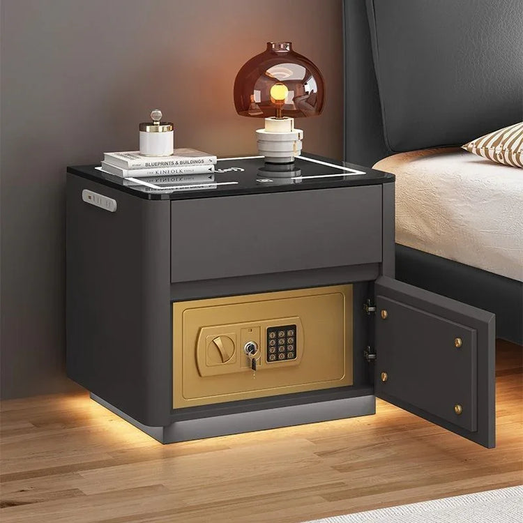 Modern black nightstand with glass top, LED lighting, built-in gold safe, and decorative lamp
