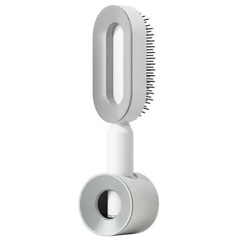 Modern white electric hair brush with sleek design and fine metal bristles