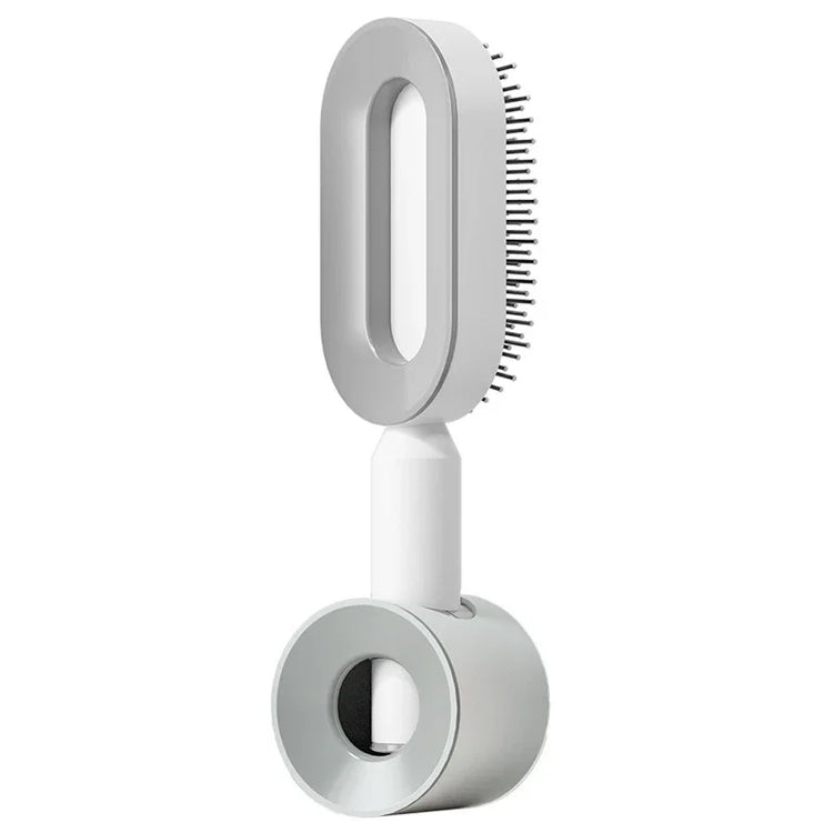 Modern white electric hair brush with sleek design and fine metal bristles