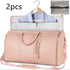Light pink faux leather duffel bag with garment storage, gold zippers, and detachable strap