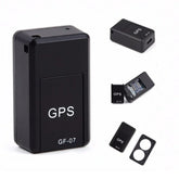 Black compact GPS tracker device with rectangular shape and visible internal circuit.