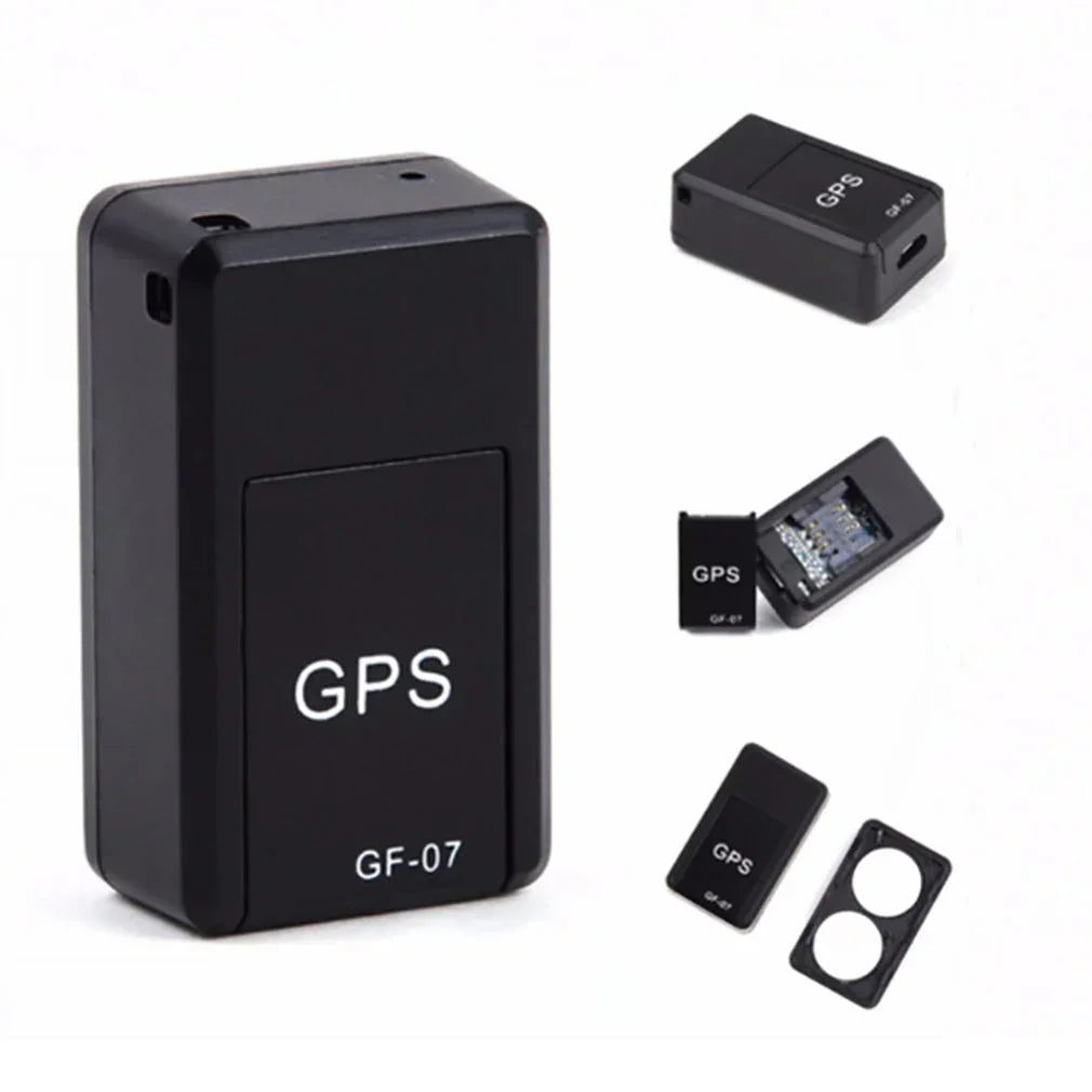 Black compact GPS tracker device with rectangular shape and visible internal circuit.