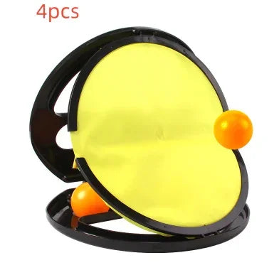 Set of four yellow and black paddle catch discs with two orange balls, plastic material