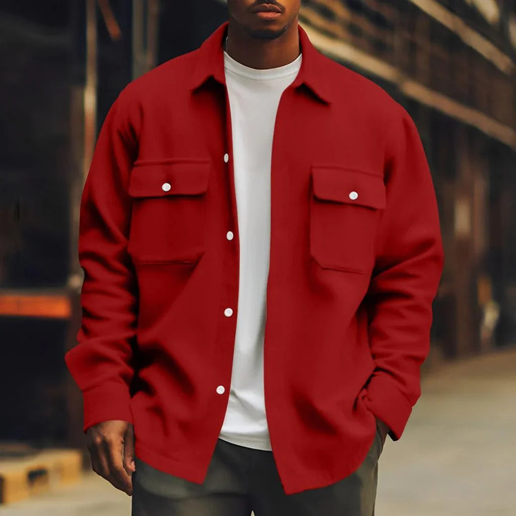 Man wearing oversized red button-up shirt jacket with chest pockets, white t-shirt, streetwear style