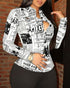 Woman wearing fitted long-sleeve black and white newspaper print top with black pants