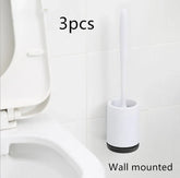 Minimalist wall-mounted white toilet brush and holder set in modern bathroom