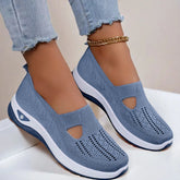 Light blue knit slip-on sneakers with breathable mesh, white soles, and relaxed fit
