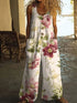 Woman wearing a loose-fit white floral linen jumpsuit with large buttons and wide legs
