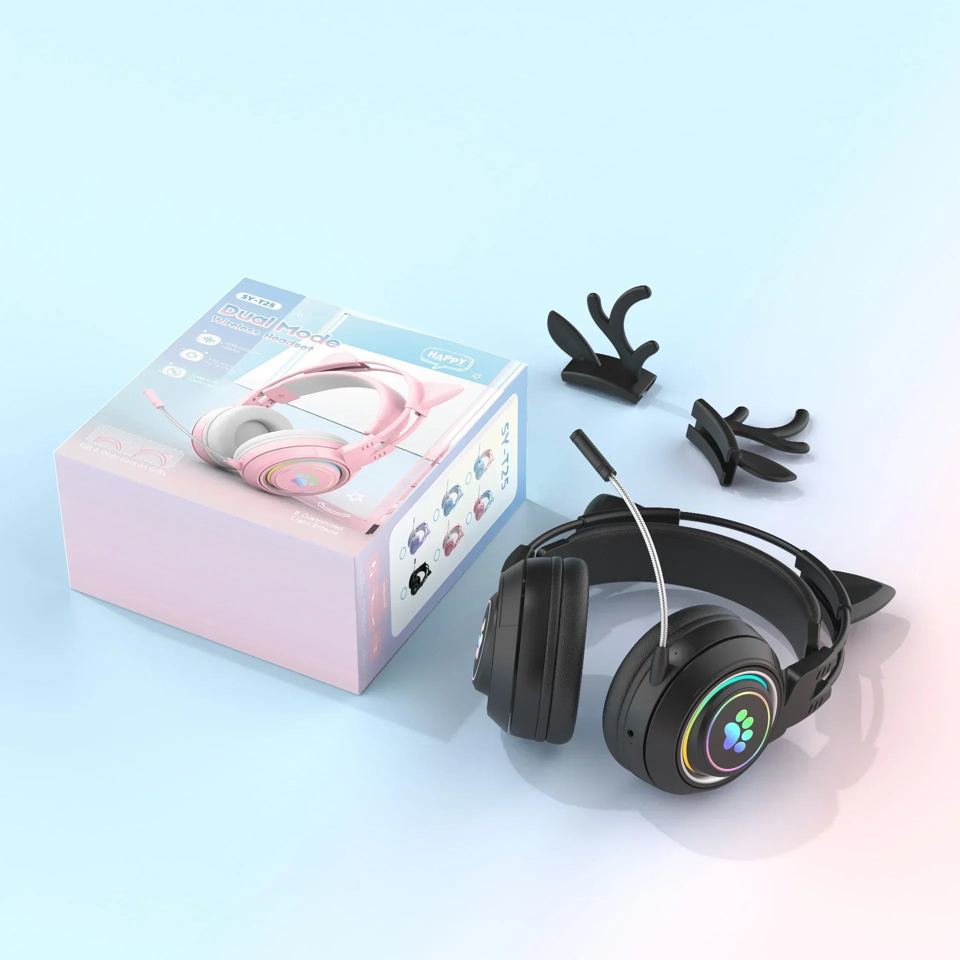 Black over-ear gaming headset with cat ear attachments, rainbow LED lights, flexible microphone, on pastel blue background next to product box.