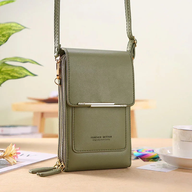 Olive green faux leather crossbody bag with flap closure and zipper details, minimalist design