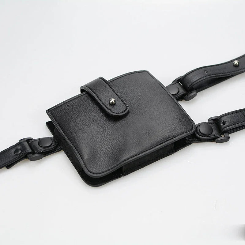 Black faux leather utility belt bag with adjustable straps and snap closure, modern streetwear accessory