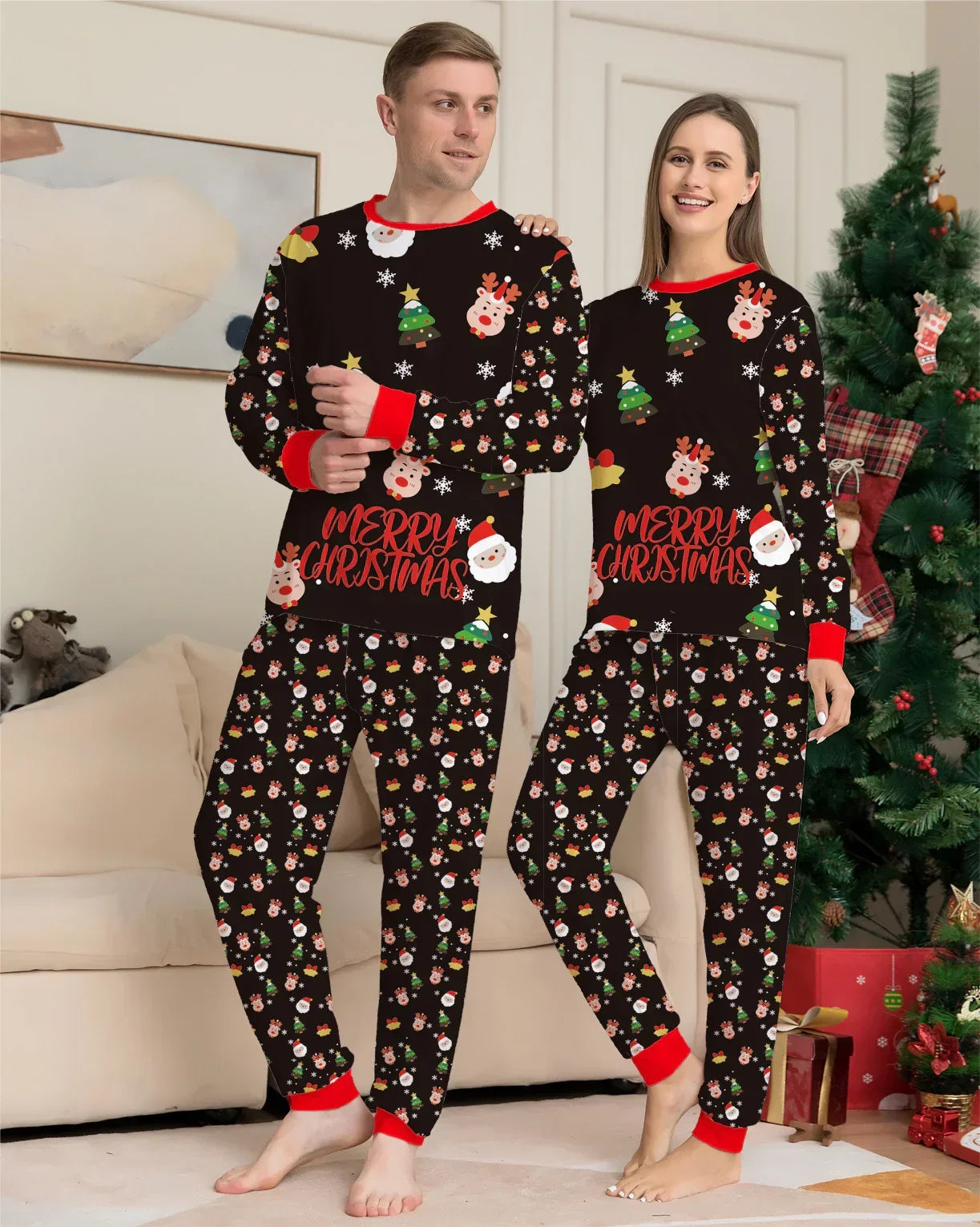 Couple wearing matching black Christmas pajamas with festive print, red trim, relaxed fit