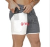 Grey athletic shorts with white inner liner, stretchy fit, drawstring waist, ideal for active wear