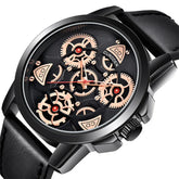 Black leather strap watch with exposed gold gears and a black stainless steel case