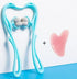 Blue plastic neck massager with roller balls and pink heart-shaped gua sha tool on blue background