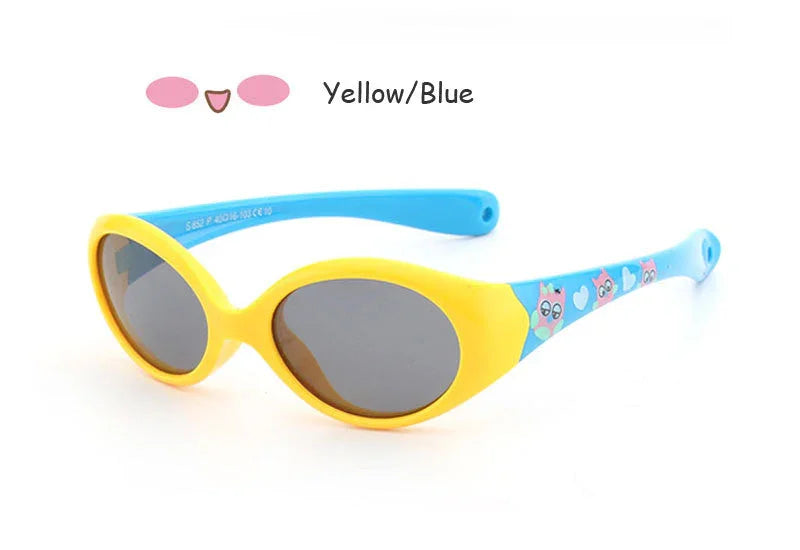 Yellow and blue oval sunglasses with cartoon graphics, glossy plastic frame, kids fit