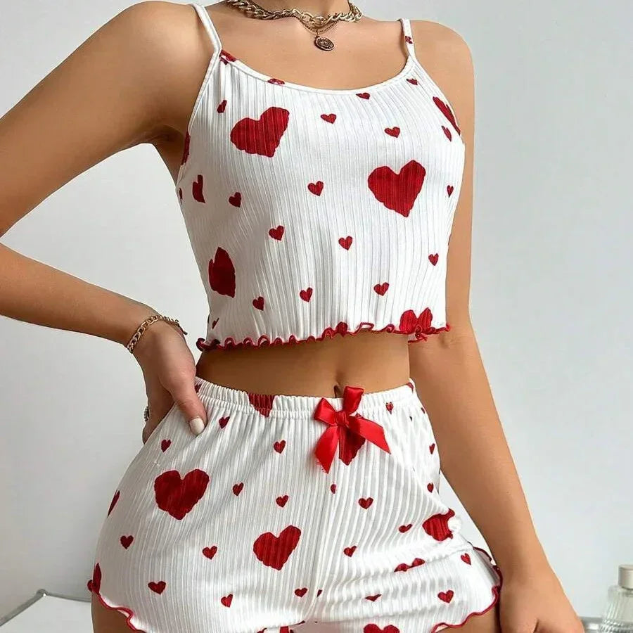 White ribbed crop top and shorts pajama set with red heart print, fitted and sleeveless