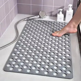 Gray non-slip shower mat with large holes, PVC material, slip-resistant bath fit.