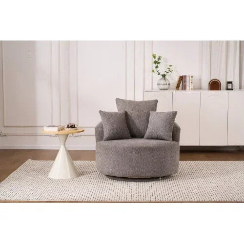 Gray textured swivel accent chair with plush cushions, modern fit, in a minimalist living room
