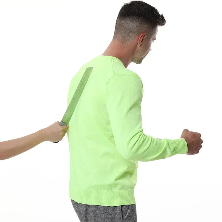 Man wearing a neon green long sleeve knit sweater with regular fit and ribbed cuffs