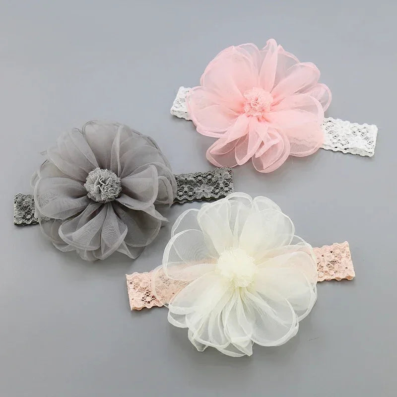 Sheer chiffon floral headbands in gray, pink, and white with lace elastic bands