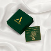 Amberta Solid Italian 14K gold wedding band box with authenticity card on white silk background