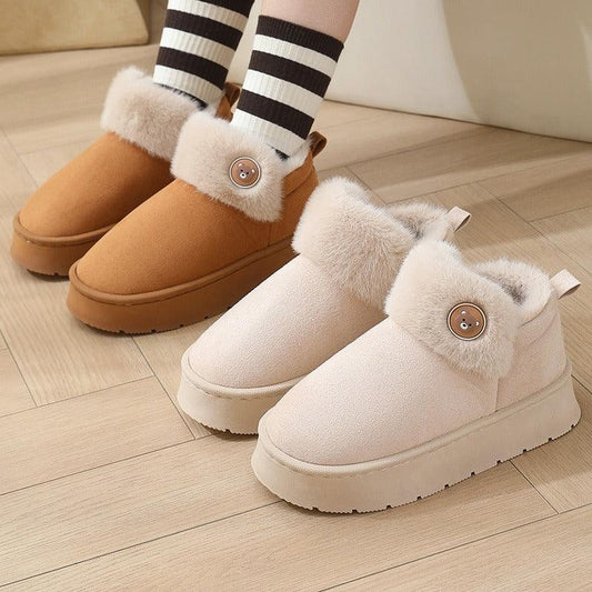 Cozy fleece-lined slip-on slippers in brown and beige with plush fur trim and bear button detail