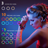 Woman illuminated by colorful selfie ring light showing 26 color modes on blue background