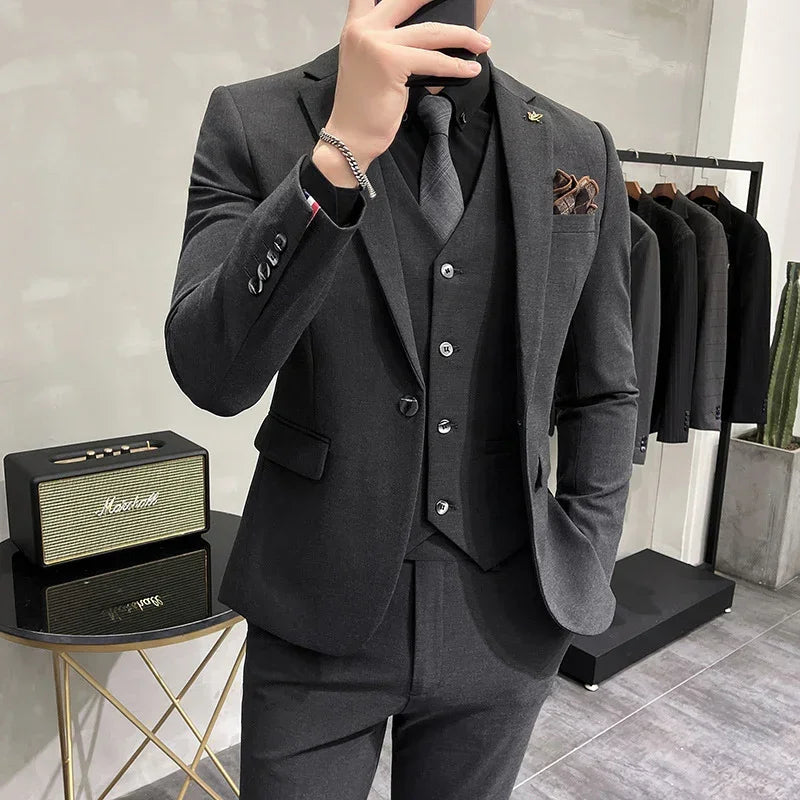 Men's slim fit charcoal gray suit with matching vest and tie, modern formal streetwear style