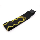 Black elastic streetwear headband with yellow geometric pattern on soft fabric