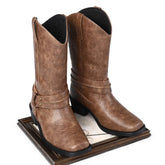 Brown faux leather western boots with decorative stitching and mid-calf fit on display.